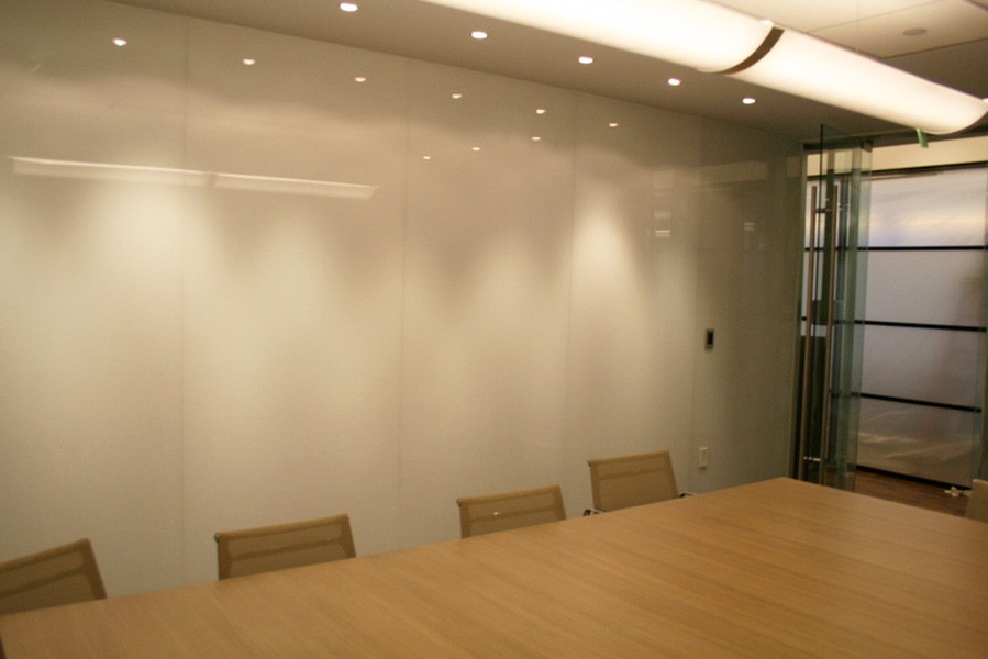 office conference room with tall white back painted glass dividers