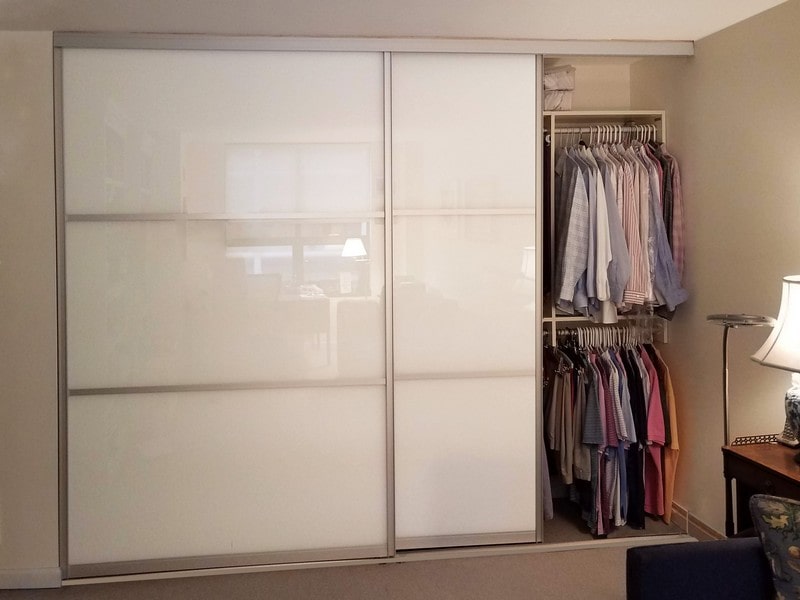 double bypass sliding glass doors in brushed nickel grid design with white painted glass