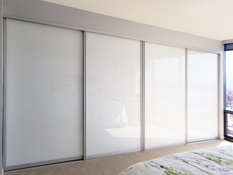 four panel white painted glass bypass sliding doors